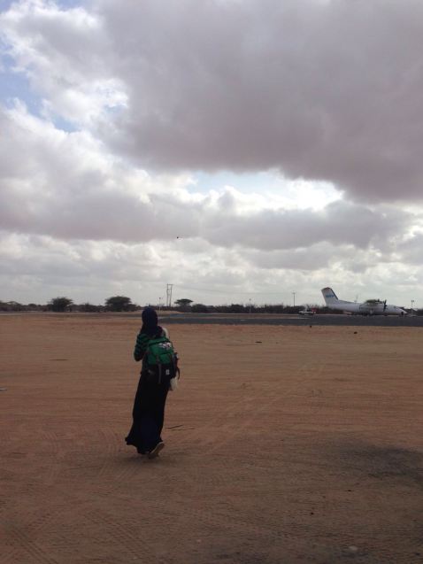 Hawa walking across the airstrip in Dadaab